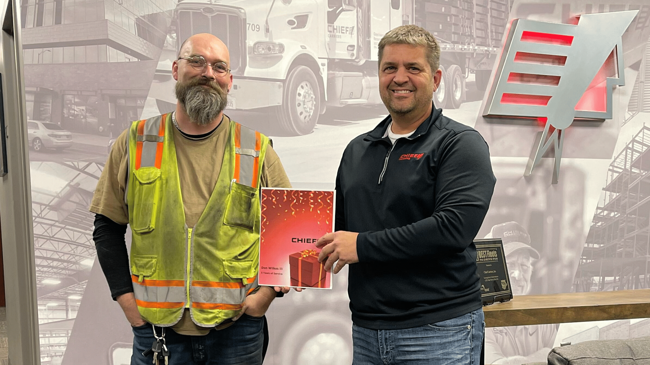 driving flatbeds two male truck drivers