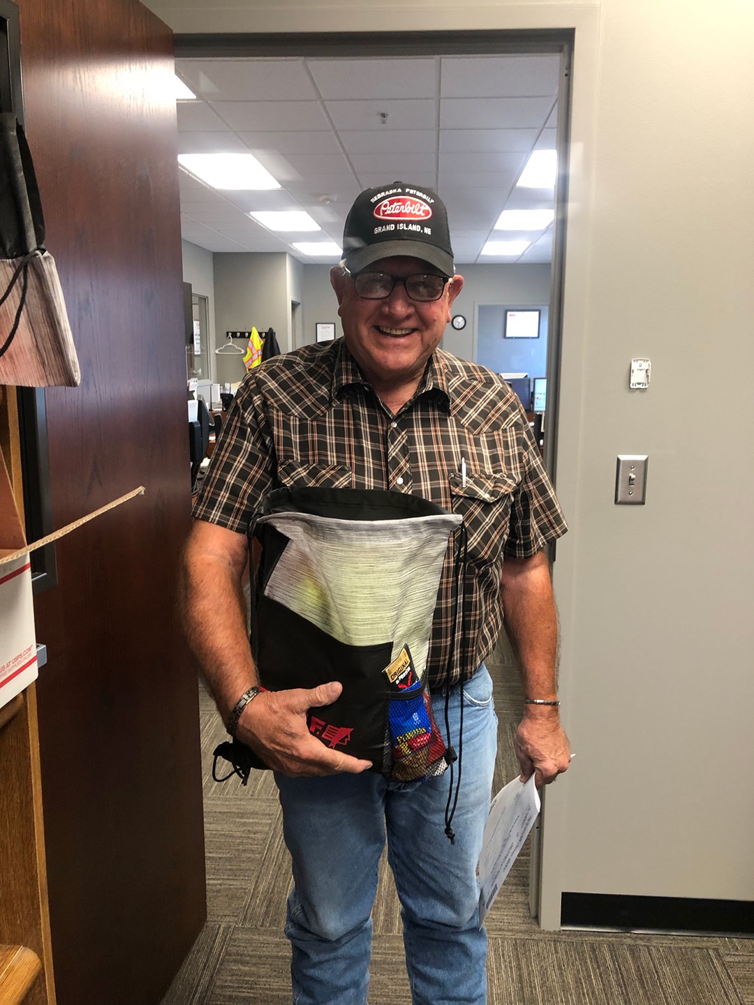 nebraska truck driver receiving a chief carriers bag of goodies for his trip