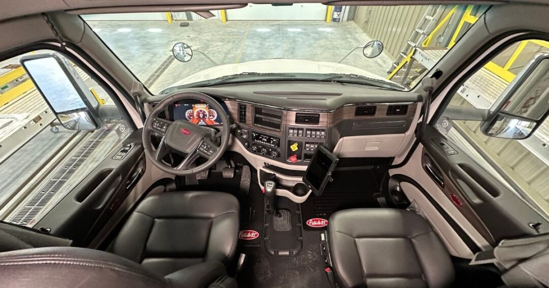 The inside of a semi truck cab