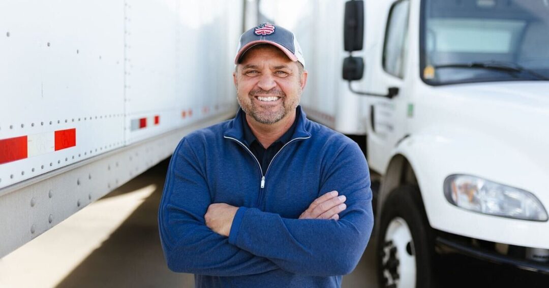 A smiling truck driver