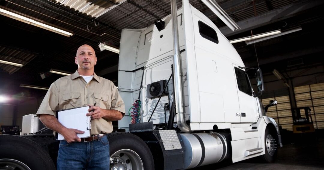 Truck driver ready to perform a pre-trip maintenance check.
