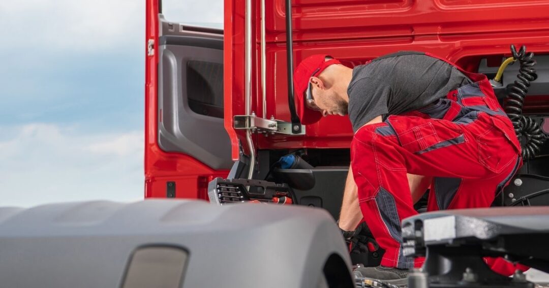 A technician performing truck maintenance.