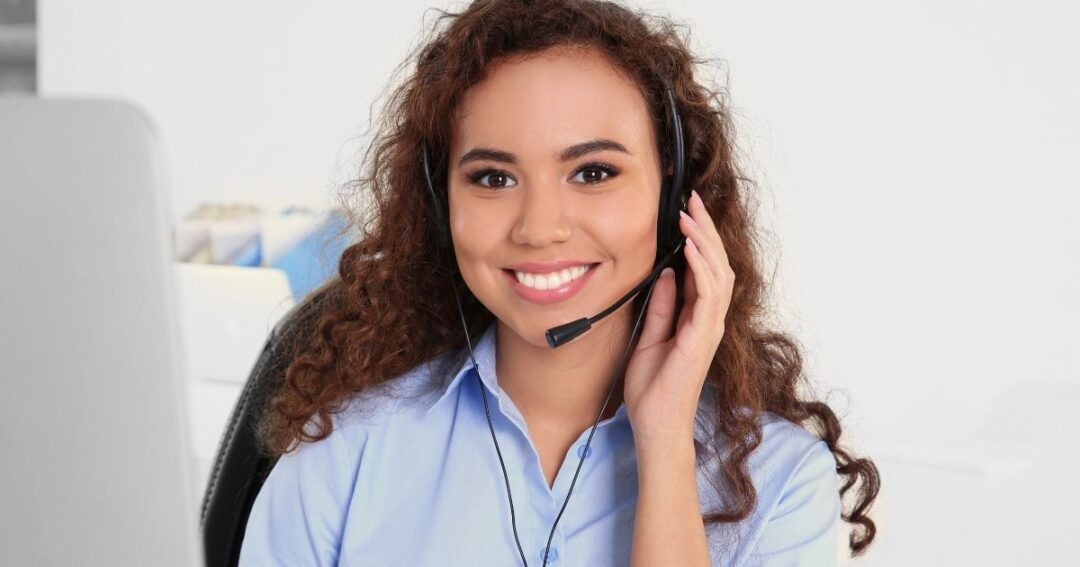 A smiling female dispatcher.