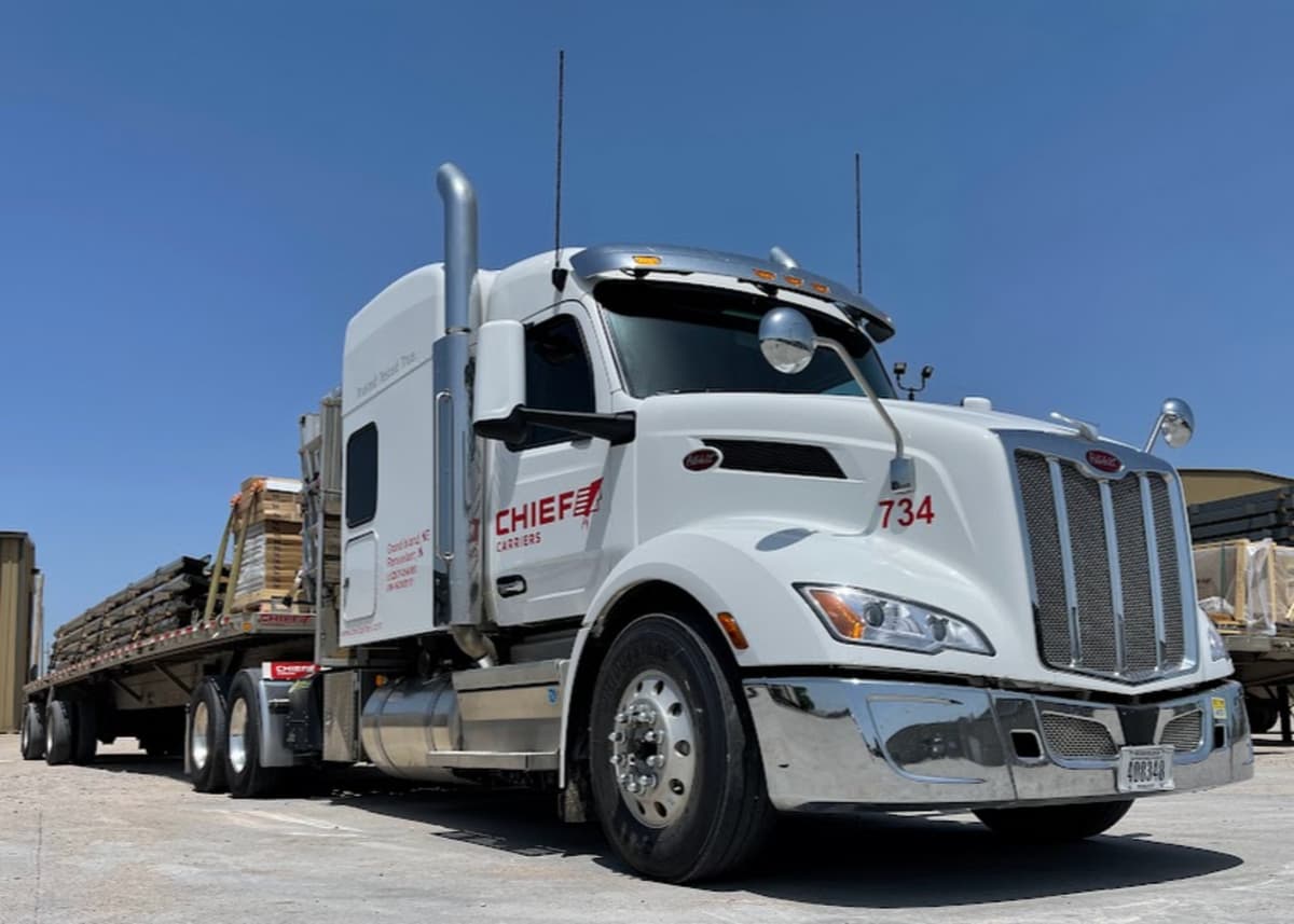 Low angle view of Chief Carriers truck and loaded trailer.