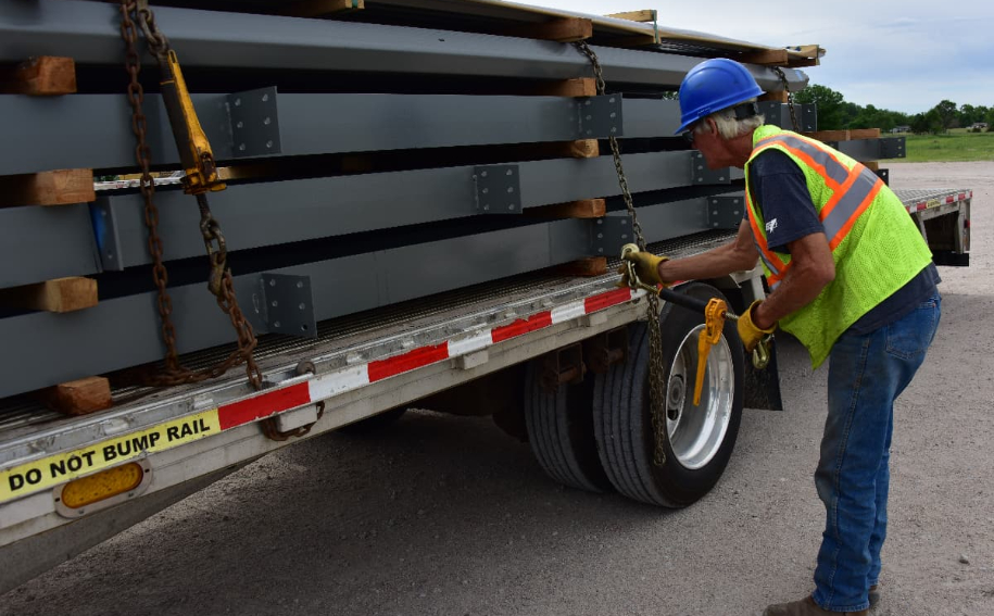 Chief Carriers driver securing a flatbed load.