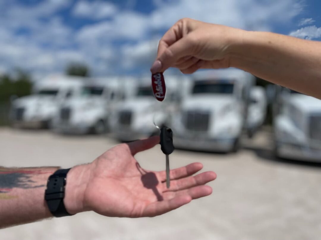 Driver receiving keys for his leased truck.