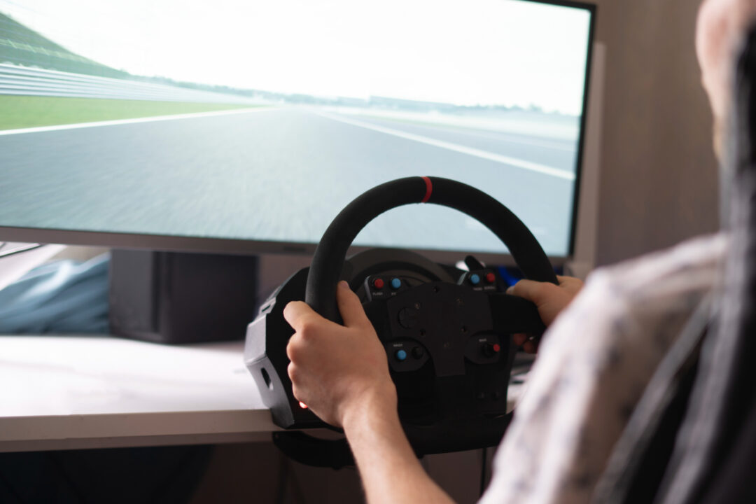 Unidentified person using a driving simulator.