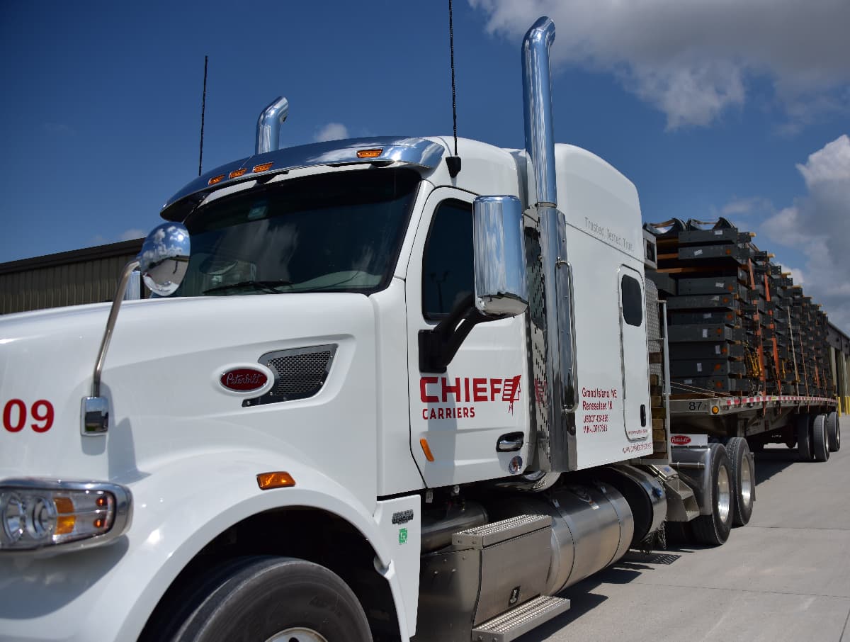A loaded Chief Carriers flatbed truck ready to make a delivery.