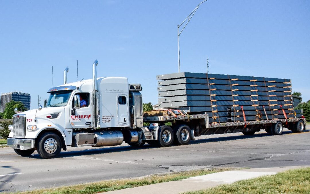 A Chief Carriers truck with a full flatbed load.