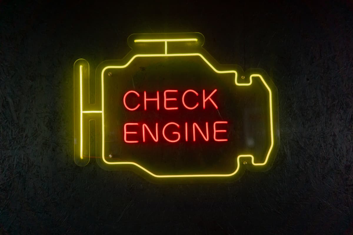 A neon sign in the shape of a check engine light.