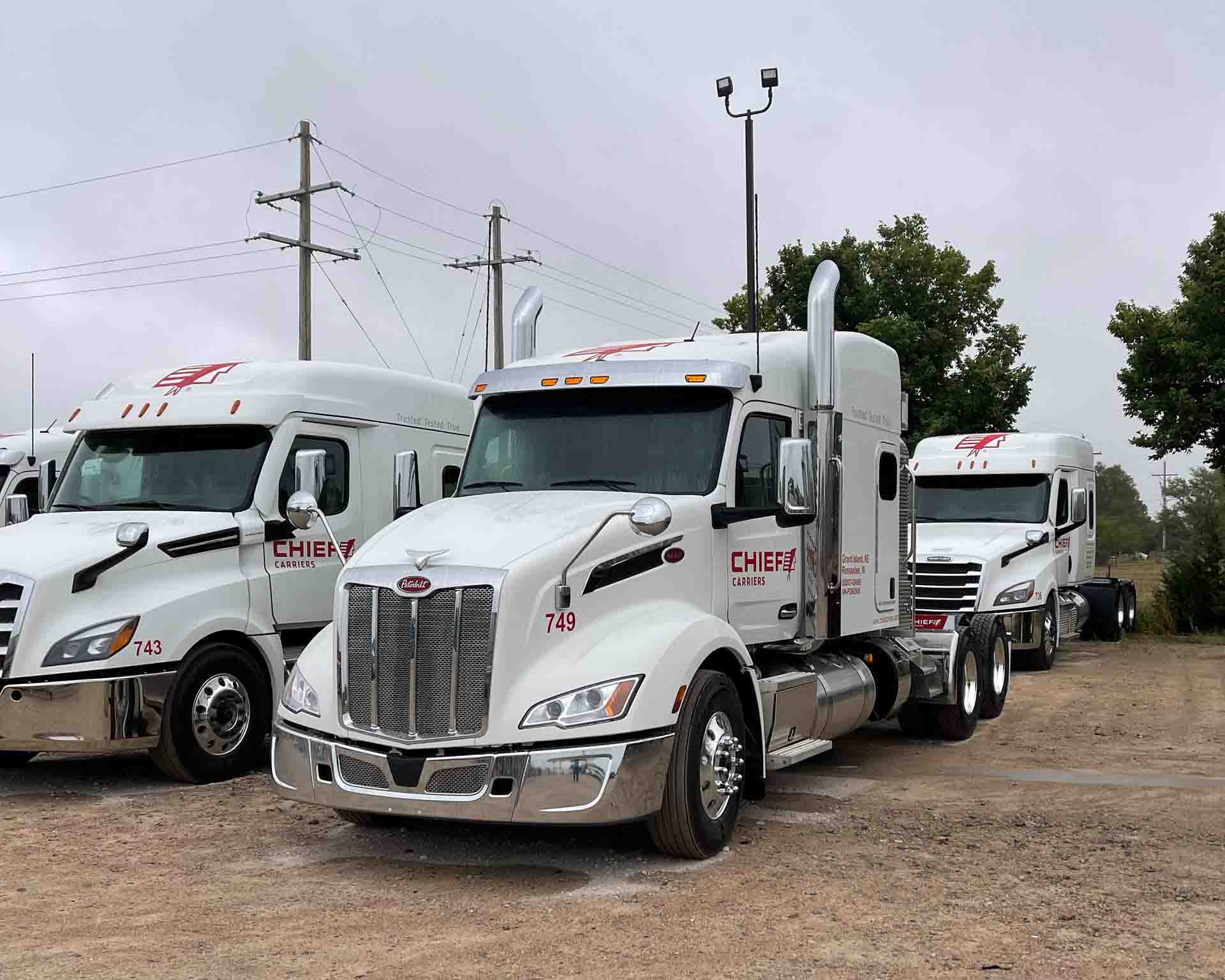 three Chief Carriers semis parked together