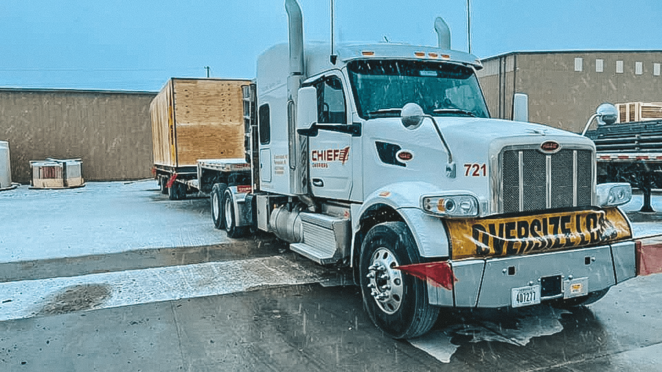 a white semi tractor with a flatbed in Nebraska.